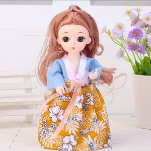 Cute Doll in Blue and Yellow Floral Dress